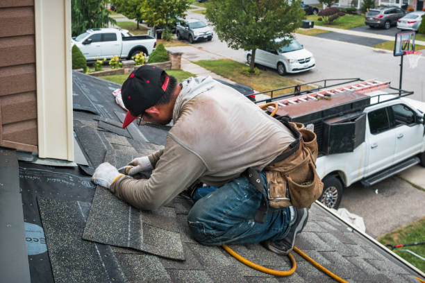 Professional Roof Replacement technician working in Melrose Park, NY